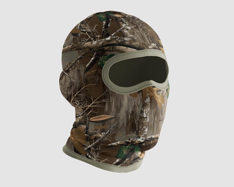 May include: A camouflage balaclava with a neutral-colored trim around the eye and mouth opening. The balaclava features a realistic forest pattern with brown, green, and tan hues, designed to blend with natural surroundings. The head covering is designed to cover the head and neck.