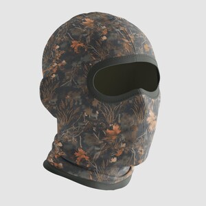 May include: A camouflage balaclava with a dark green trim around the eye opening and base. The balaclava features a pattern of brown and orange leaves and foliage on a dark gray background.
