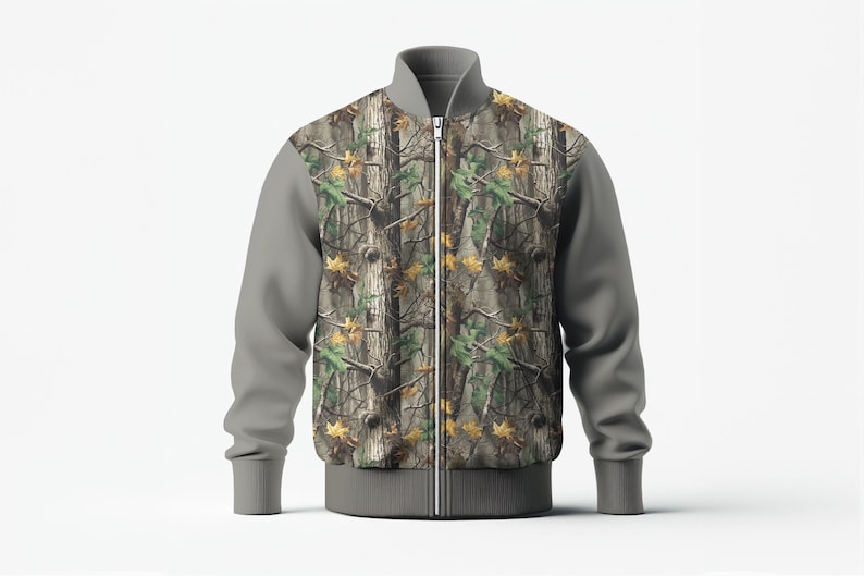 May include: A camouflage bomber jacket with a full-zip closure. The jacket features a woodland camouflage pattern on the front and back panels, with gray sleeves, collar, and hem. The jacket is designed with a ribbed collar, cuffs, and hem.