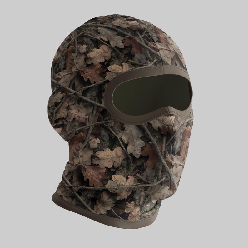 Puede incluir: Pasamonta&ntilde;as de camuflaje con un patr&oacute;n de hojas de roble marrones y beige. La abertura para los ojos es grande y est&aacute; delineada en marr&oacute;n. El pasamonta&ntilde;as est&aacute; dise&ntilde;ado para cubrir la cabeza y el cuello.