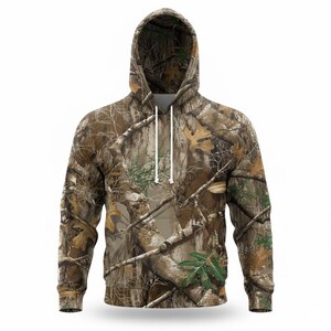 May include: A hooded sweatshirt with a camouflage pattern in shades of brown, green, and tan. The hoodie features a drawstring and a front pocket. The design incorporates images of branches, leaves, and bark.