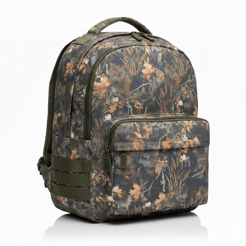 May include: A camouflage backpack with a front pocket and green accents. The backpack features a handle, shoulder straps, and side straps. The camouflage pattern includes shades of brown, green, and tan.
