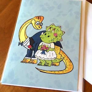 Tarjeta de boda con diseño de dinosaurio