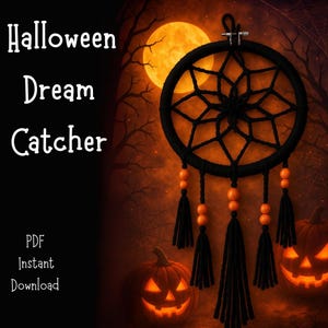 May include: A black Halloween dream catcher with orange beads and tassels hangs against a backdrop of a full moon and jack-o'-lanterns. The words "Halloween Dream Catcher" are displayed in white text.