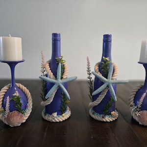 Beach decor wine bottle and wine glass centerpiece.