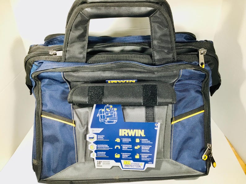 May include: A blue and black IRWIN tool bag with a black handle and zipper closures. The bag has yellow accents and a front pocket with a label that reads "IRWIN" and "18 in." The bag is designed for tool storage.