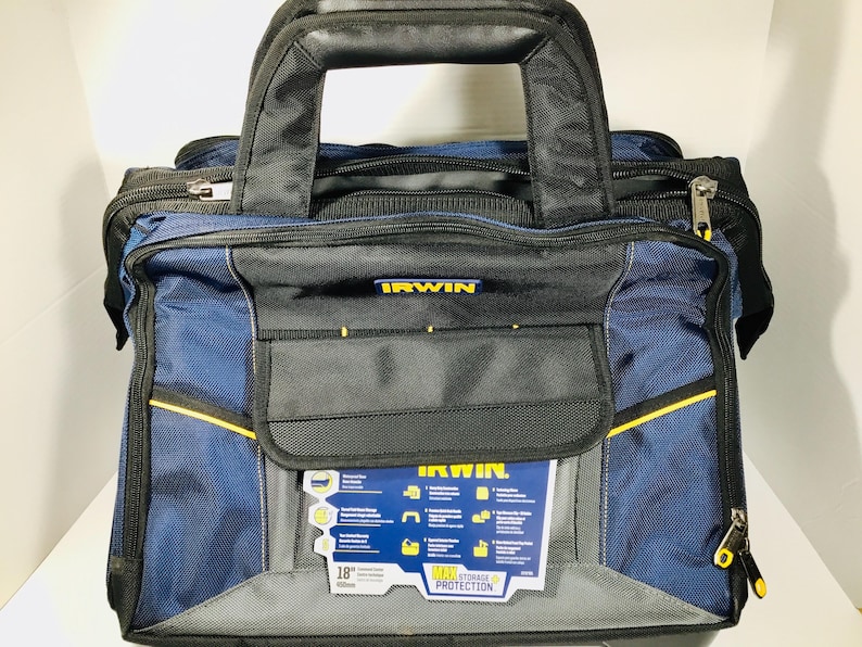 May include: A blue and black IRWIN tool bag with a black handle and yellow accents. The bag has multiple compartments and a front pocket. The bag is 18 inches (45.7 cm) wide and features a label with product information.