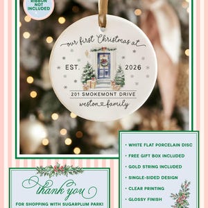 May include: A round white porcelain ornament featuring a watercolor illustration of a front door with a wreath, two small Christmas trees, and wrapped gifts. Text reads: our first Christmas at, EST. 2026, 201 SMOKEMONT DRIVE, weston family.