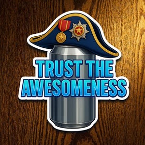 May include: A sticker featuring a silver can with a blue and gold bicorne hat on top. The text "TRUST THE AWESOMENESS" is in blue and white. The background is a wooden surface.