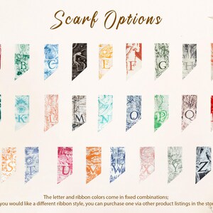 May include: A collection of twenty-six rectangular fabric swatches labeled Scarf Options, each featuring a unique letter from A to Z in a specific color and intricate pattern. The letters are arranged in a grid, showcasing various color combinations including red, green, blue, black, orange, and pink, with detailed illustrations printed on each individual swatch.