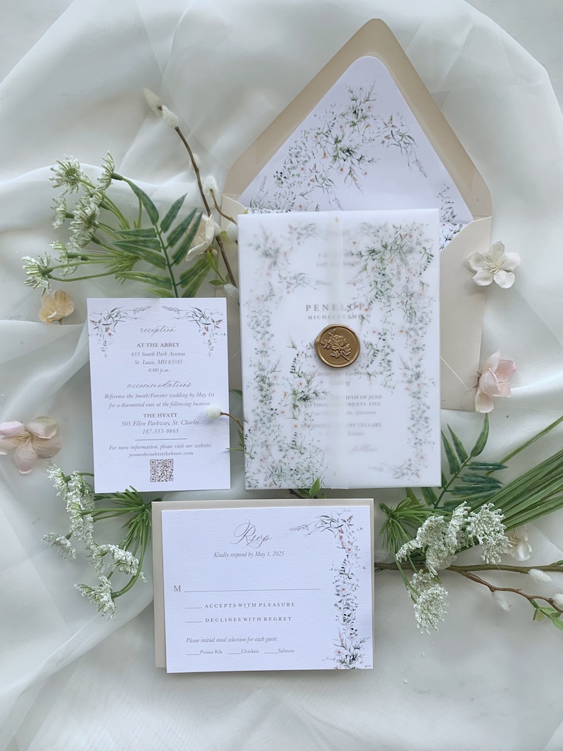 May include: A wedding invitation suite with a floral design. The invitation features a watercolor illustration of delicate white flowers and greenery. The RSVP card has a floral border and a space for guests to indicate their attendance. The text on the invitation reads "Penelope & Michael Smith" and the text on the RSVP card reads "RSVP kindly requested by May 1, 2023".