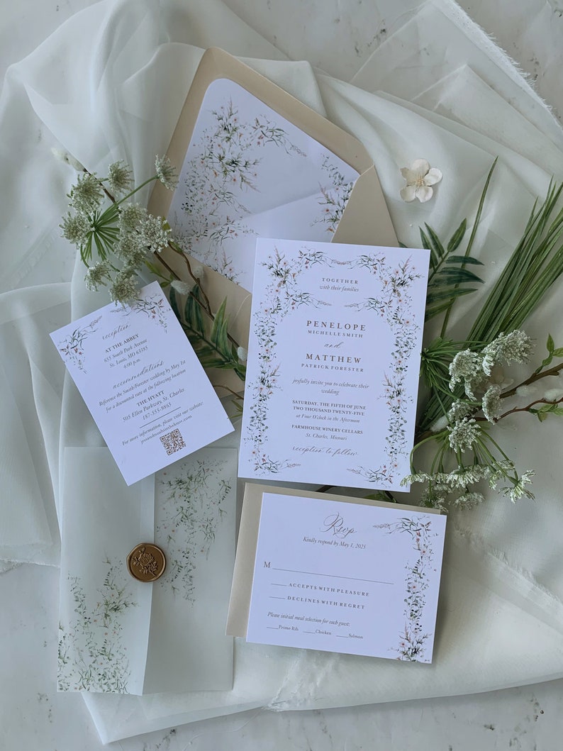 May include: A wedding invitation suite with a floral design. The invitation features a white background with a floral border and the text "Together with their families Penelope Michelle Smith and Matthew Patrick Forester Saturday, the Fifth of June Two Thousand Twenty-Five at Four O'Clock in the Afternoon Farmhouse Winery Cellars 42 Church Street St. Charles, Missouri reception to follow". The RSVP card features a white background with a floral border and the text "Kindly respond by May 1, 2021. Accepts with Pleasure Declines with Regret Please meal selection for each guest: Prime Rib, Chicken, Salmon".