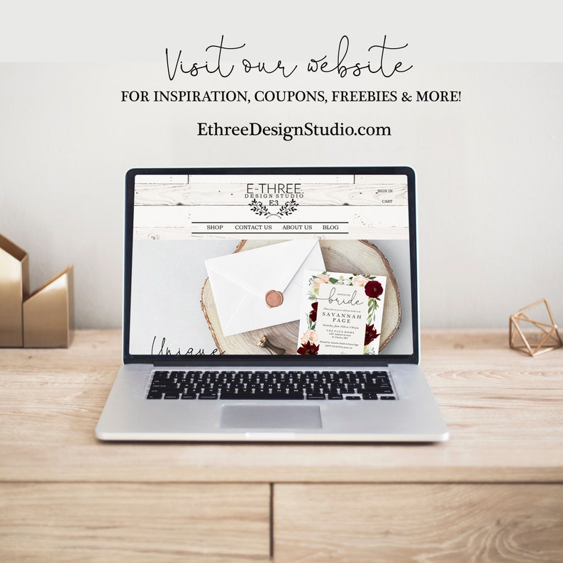 May include: A laptop computer displaying a website for a design studio called "E-Three Design Studio". The website features a shop, contact us, about us, and blog pages. The website also features a floral wedding invitation with the text "bride" and "Savannah Page".