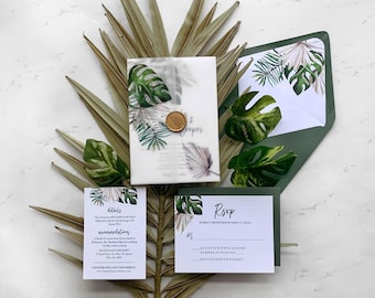 May include: Tropical-themed wedding invitation suite with a green and white color scheme. The invitation features a wax seal and a leafy design. The RSVP card has a green background and white text. The details card has a white background and black text.