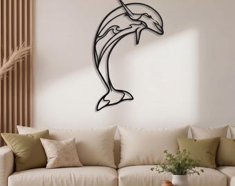 May include: A black metal wall art piece shaped as a stylized dolphin in a leaping position. The design features clean, continuous lines forming the silhouette of the dolphin, with an abstract wave pattern integrated into the body of the creature.