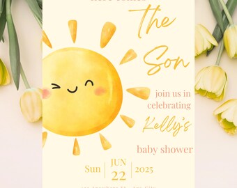 May include: Baby shower invitation with a watercolor illustration of a smiling sun. The text reads "Here Comes The Son" and invites guests to celebrate Kelly's baby shower on June 22, 2025.