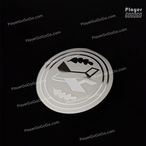 May include: A circular silver metal emblem with an aeroplane design. The emblem features an outline of an aircraft, clouds, and other graphic elements. The background is black.