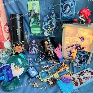 May include: A collection of anime-themed merchandise, including a black tumbler with orange leaf designs, character figurines, keychains, and acrylic stands. The items are arranged on a blue fabric background.