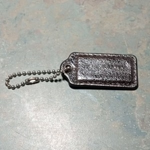COACH Silver Textured Leather 2&quot; x 1&quot; Purse Fob Hang Tag Charm.