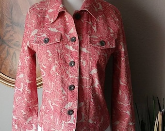 May include: A red and cream paisley patterned jacket with a button front closure and two flap pockets.