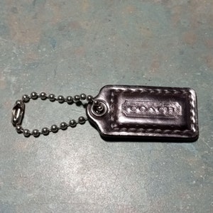 COACH Silver Leather 1.5&quot; x 5/8&quot; Wristlet Purse Fob Hang Tag Charm.