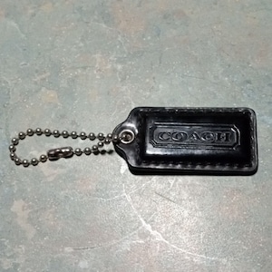 COACH Black Patent Leather Signature Coach Purse Hang Tag. 2&quot; x 1&quot; Bronze Ball Chain.