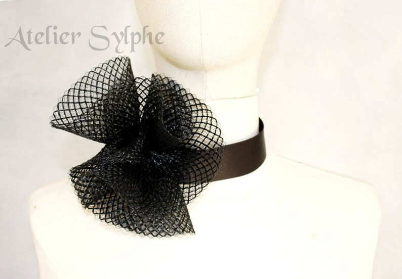 Black fantasy ruffle neck asymmetric collar with delicate soft horsehair style back closure on elastic neck band