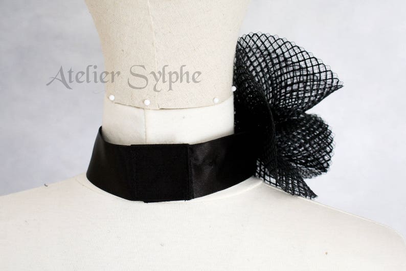 Black fantasy ruffle neck asymmetric collar with delicate soft horsehair style back closure on elastic neck band