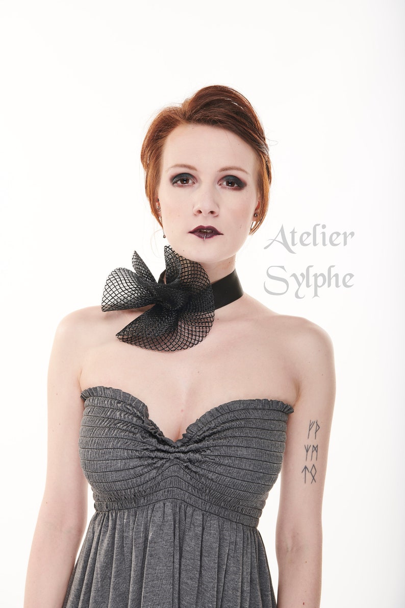 Black fantasy ruffle neck asymmetric collar with delicate soft horsehair style back closure on elastic neck band
