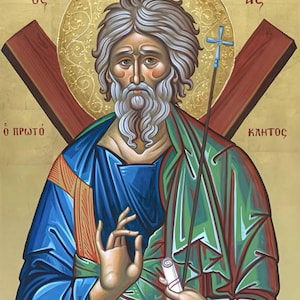 May include: An icon of a saint with a halo, holding a cross and a scroll. The saint has a long white beard and gray hair. The background is gold with Greek text.
