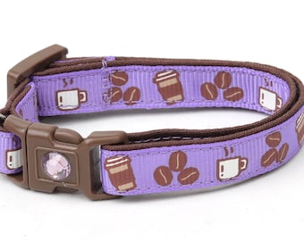 May include: Purple cat collar with a brown coffee cup and coffee bean pattern. The collar has a small purple bell.