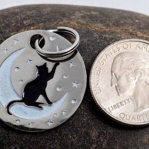tag next to a US quarter for scale. The tag is slightly wider than the quarter.