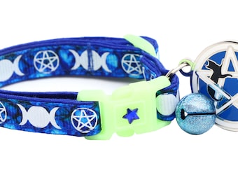 May include: Blue cat collar with a white triple moon and pentagram pattern, a green buckle, a blue star charm, and a silver charm with a blue pentagram and a black cat silhouette.