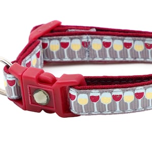 May include: Red and gray dog collar with a wine glass charm. The collar has a repeating pattern of wine glasses with red and white wine.