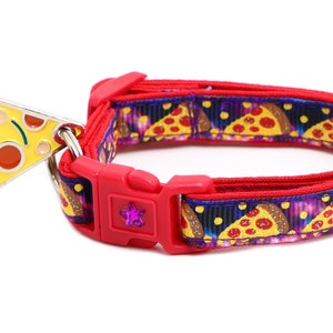 May include: Red and purple dog collar with a pizza slice charm. The collar has a red buckle with a pink star.