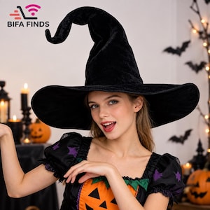 May include: A black velvet witch hat with a tall, pointed, and slightly curved crown and a wide, circular brim. The hat features a soft, textured fabric surface and is presented in a solid black colour, designed for costume wear.