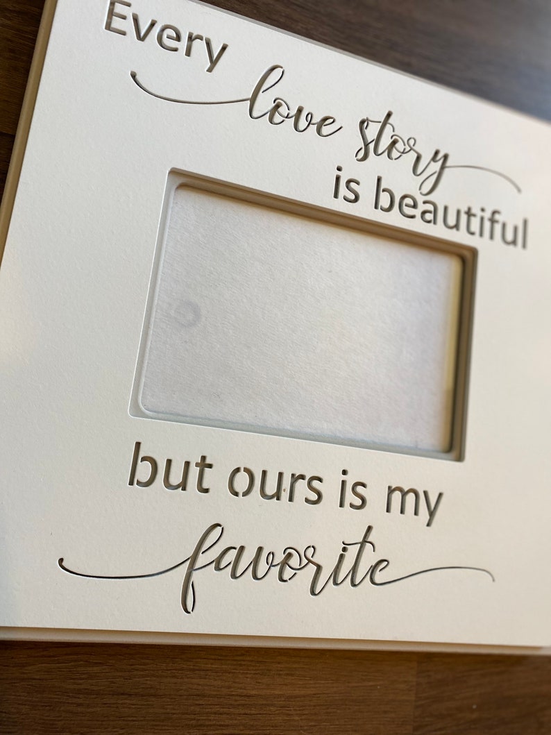 Frame with qoute Every Love Story is beautiful, but ours is my Favorite. frame measures 11.75 X 11.75 and holds a 5X7 photo. image 3