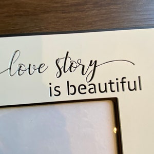 Frame with qoute Every Love Story is beautiful, but ours is my Favorite. frame measures 11.75 X 11.75 and holds a 5X7 photo. image 4