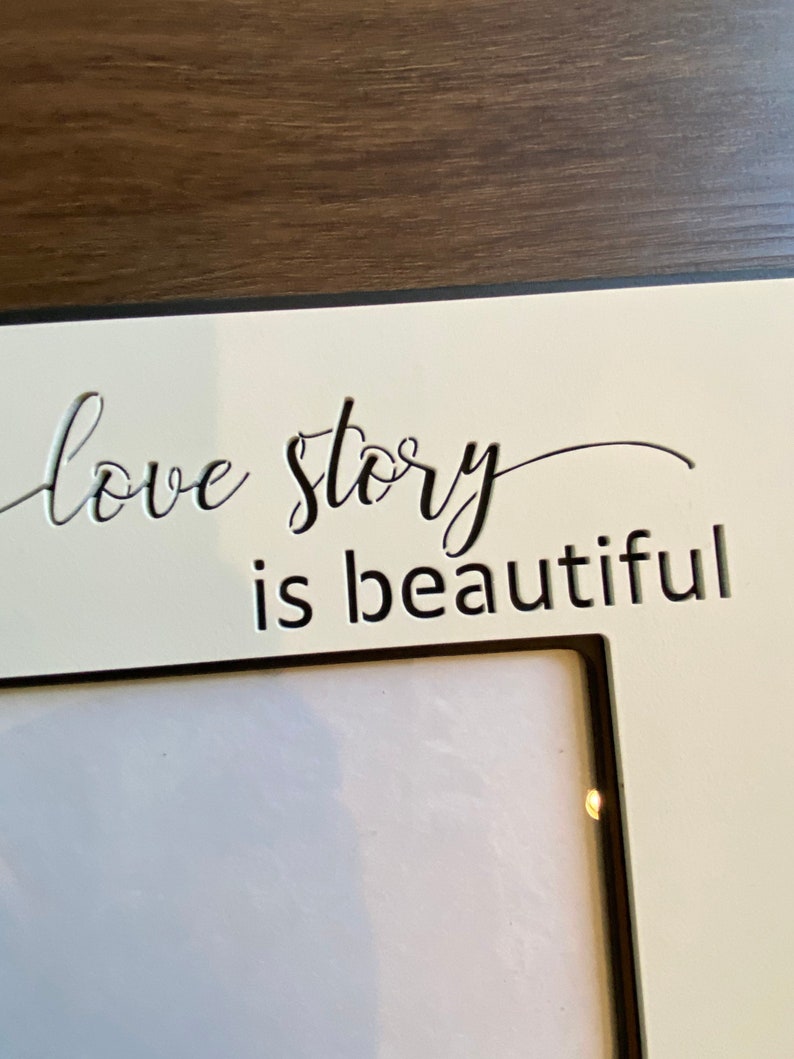 Frame with qoute Every Love Story is beautiful, but ours is my Favorite. frame measures 11.75 X 11.75 and holds a 5X7 photo. image 4