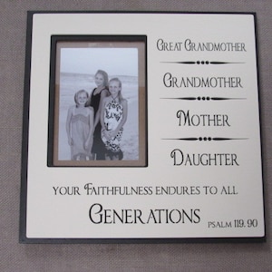 May include: A square, off-white picture frame with a black border. The frame holds a black and white photo of three people. Text on the frame reads "Great Grandmother, Grandmother, Mother, Daughter" and "Your Faithfulness Endures to All Generations, Psalm 119:90."