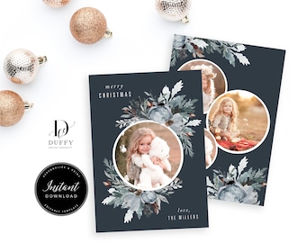 May include: A blue and white Christmas card with a watercolor floral design. The card features a photo of a young girl holding a teddy bear. The text on the card reads "merry christmas" and "love, the millers".