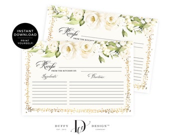 May include: Two white recipe cards with a gold glitter border and white floral design. The text on the cards reads "Recipe from the kitchen of:" and includes spaces for ingredients and directions.