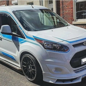 May include: White Ford Transit Connect van with blue detailing and black alloy wheels. The van features a front spoiler and side steps. The Ford badge is on the front.