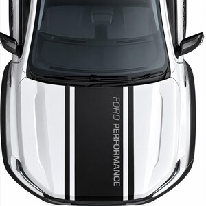May include: A white vehicle bonnet featuring a wide black centre stripe flanked by two thinner black stripes on each side. The text FORD PERFORMANCE is printed in a bold, vertical white font within the central black stripe area.