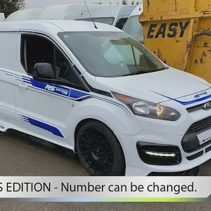 May include: White van with black wheels and blue and black detailing. The van features the text "RS EDITION - Number can be changed." at the bottom. The van is parked near a yellow skip.