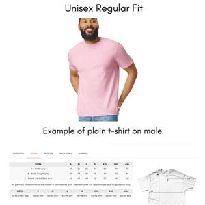 May include: A light pink Gildan Softstyle t-shirt, cotton, unisex regular fit. The image shows a person wearing the t-shirt. The image also includes a size chart with measurements in inches and centimeters.