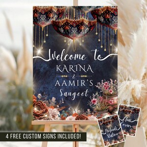 May include: A decorative sign on an easel with the text "Welcome to KARINA & AAMIR'S Sangeet". The sign has a dark blue background with floral and ornamental design elements. Includes 4 free custom signs.