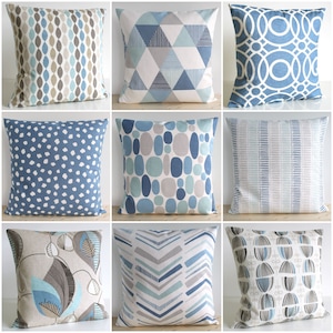 May include: Nine different throw pillow covers with geometric and abstract patterns in shades of blue, grey, and white. The pillow covers are all square and have a variety of designs, including polka dots, stripes, and chevron.
