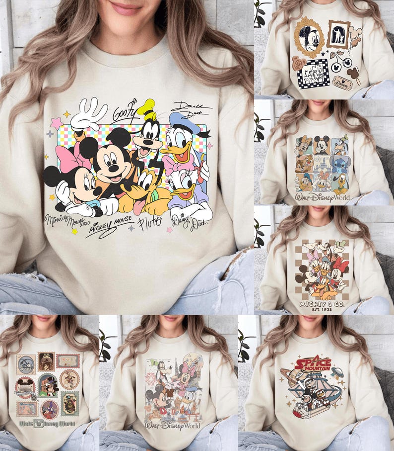 May include: Beige sweatshirts with Disney character designs. One features Mickey Mouse, Minnie Mouse, Donald Duck, Daisy Duck, Goofy, and Pluto. Other designs include Mickey & Co., Space Mountain, and various Disney World graphics.