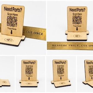 May include: A wooden stand with the text "Need Parts?" and a QR code, with "Scan Here" and "Tap Here" below. The stand has a slot for a card and a contactless payment symbol. A ruler with the text "Measure Twice, Cut Once" is also visible.